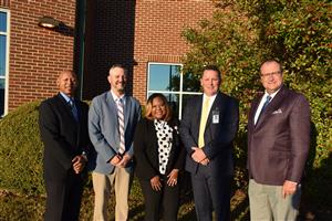 Group photo of Madison City Board of Education members, Mayor Finley, Superintendent Nichols, and several other leaders. 